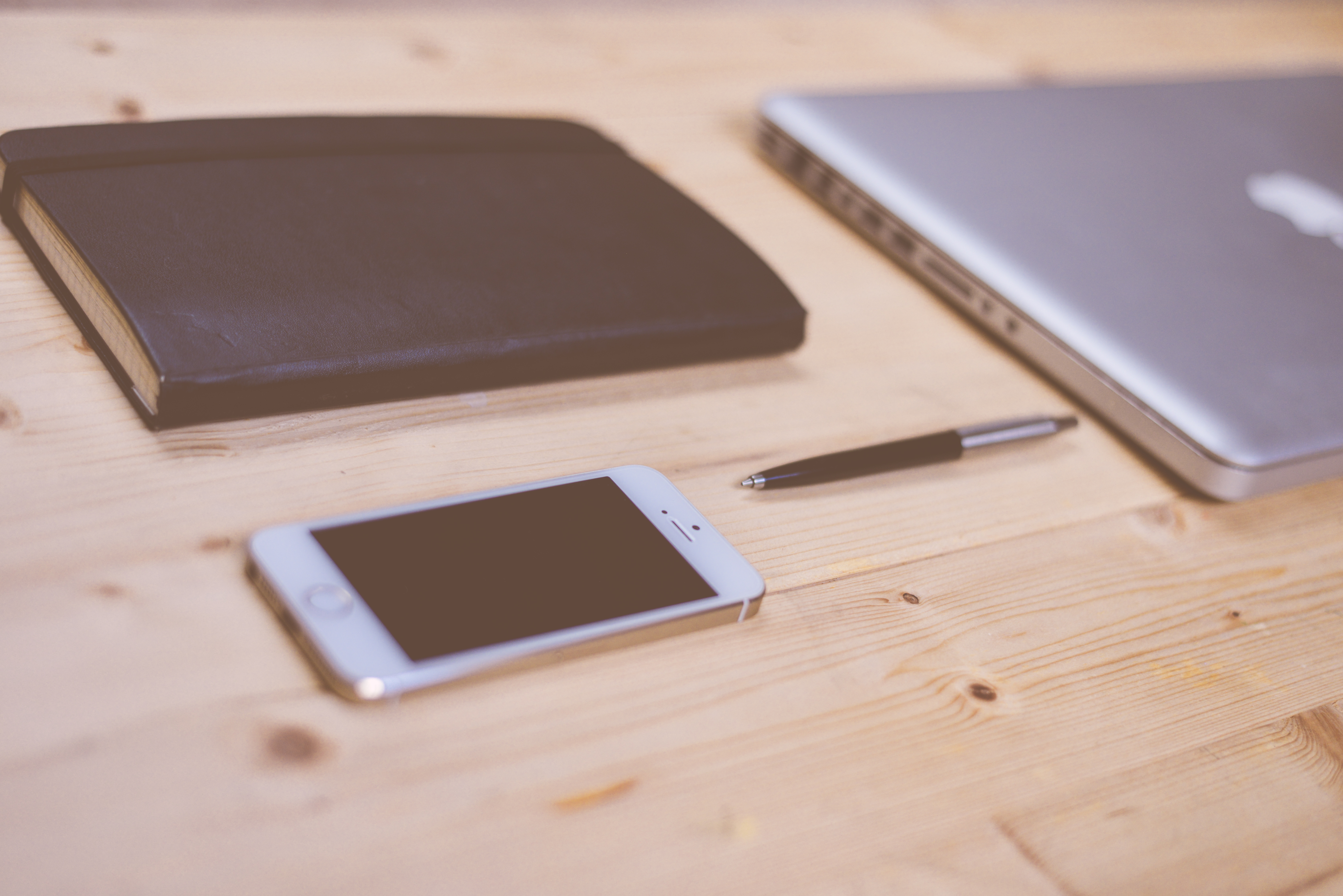 Smartphone and laptop desk setup illustrating responsive web design planning